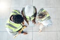 Teamwork, tablet or engineer construction workers working, collaboration on building project at construction site. Above