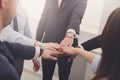 Teamwork and teambuilding concept in office, people connect hand, closeup Royalty Free Stock Photo