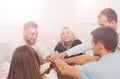 Teamwork and teambuilding concept in office, people connect hand