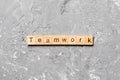 TEAMWORK word written on wood block. TEAMWORK text on cement table for your desing, concept Royalty Free Stock Photo