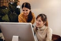 Teamwork, Working Together. Smiling Two Business Woman Workigng on Computer in Modern Office