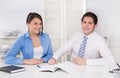 Teamwork - young business colleagues in a meeting discussing - y Royalty Free Stock Photo