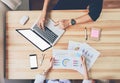 Teamwork, Young businesswoman in office in casual shirt. Selecting information with colleagues with a computer. Royalty Free Stock Photo