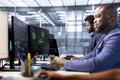 Teamworking technicians in data center getting access granted notification