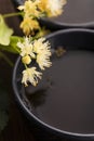 Teapot and cup with linden tea Royalty Free Stock Photo