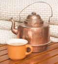 Teapot with a cup