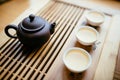 Teapot and cups with chinese tea on the table for the tea ceremony Royalty Free Stock Photo