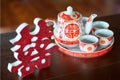 Teapot and cups used in traditional Chinese wedding ceremony wit