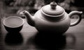 Teapot and empty cup on wooden table Royalty Free Stock Photo