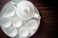 Teapot and empty cup on wooden table Royalty Free Stock Photo