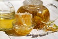 Teapot linden lavender tea and flowers on white wooden table with Fresh Honey comb and jar of Delicious fluid honey Royalty Free Stock Photo