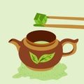 Teapot with matcha tea. Bamboo sticks hold a cube of matcha tea. Japanese ceremony with Matcha Royalty Free Stock Photo