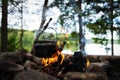 Teapot over the fire. Old vintage kettle. Beautiful campfire Royalty Free Stock Photo