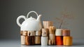 A teapot and stacked wood objects