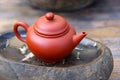 Teapot and Tea stone Plate Royalty Free Stock Photo