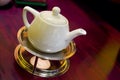 Teapot on trivet in warm light Royalty Free Stock Photo