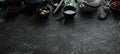 Teapot and two cups of tea on a black stone background. Top view. Royalty Free Stock Photo