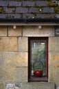 Teapot in window of house