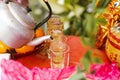 Teapots and cups filled with tea are arranged on red auspicious table. Set table to pay homage to gods, sky, the soil Royalty Free Stock Photo