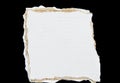 Tear white paper pieces of paper on black Royalty Free Stock Photo