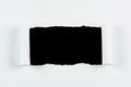 Tear white paper pieces of paper on black Royalty Free Stock Photo