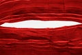 teared rag spread on white background, can use like a backdrop or any texture. big hole in the tissue. striped red cotton