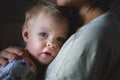 A tearful little boy clings to his mother to calm down. mother care and custody. relationship between parents and children Royalty Free Stock Photo