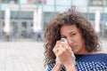 Tearful young woman wiping her eyes Royalty Free Stock Photo