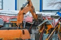 Tearing down older commercial building to make way for new business.