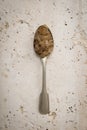 Teaspoon filled with sugar crystals Royalty Free Stock Photo