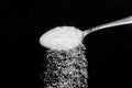 Teaspoon with sugar dunes and granulated sugar Royalty Free Stock Photo