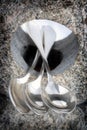 Teaspoons balancing on stone Royalty Free Stock Photo