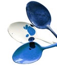 Teaspoons of blue and white on a white background insulated Royalty Free Stock Photo