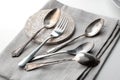 Teaspoons and fork with linen napkin close-up