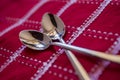 Teaspoons on a red tablecloth