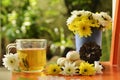 Teatime with Chinese pastry and tea and flower on a orange chair Royalty Free Stock Photo