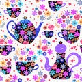 Teatime among flowers. Vector seamless pattern. Teapots and cups with beautiful floral ornament Royalty Free Stock Photo