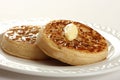 Teatime treat of crumpets and butter Royalty Free Stock Photo