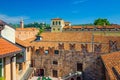 Teatro Nuovo theatre courtyard, brick wall with merlons and red tiled roof