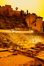 Teatro Romano de Malaga covered by orange dust storm. Malaga, Costa del Sol, Andalusia, Spain