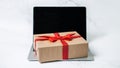 Tech gifts for Christmas for the tech-obsessed person. Gadgets and devices Xmas gift ideas. Laptop with Christmas Gift