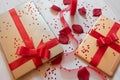 tech gifts wrapped with red gift bows