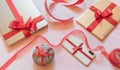 tech gifts wrapped with red gift bows