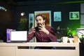 Tech guru filming tech tutorial on how to do maintenance on mockup laptop