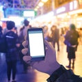 Tech interaction Hands with smartphone, blurred people buying tickets