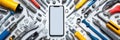 Tech Repair Setup With Smartphone Surrounded by Various Tools for Efficient Equipment Maintenance and Restoration Royalty Free Stock Photo