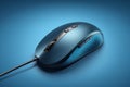 Close up of a blue wired computer mouse,Generative AI Royalty Free Stock Photo