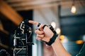 At a technical college a teen boy learns technology by testing a robot hand and Royalty Free Stock Photo