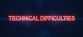 Technical difficulties neon sign on dark background Royalty Free Stock Photo