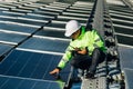 Technical expert in solar energy photovoltaic panels, remote control performs routine actions for system monitoring using clean, Royalty Free Stock Photo